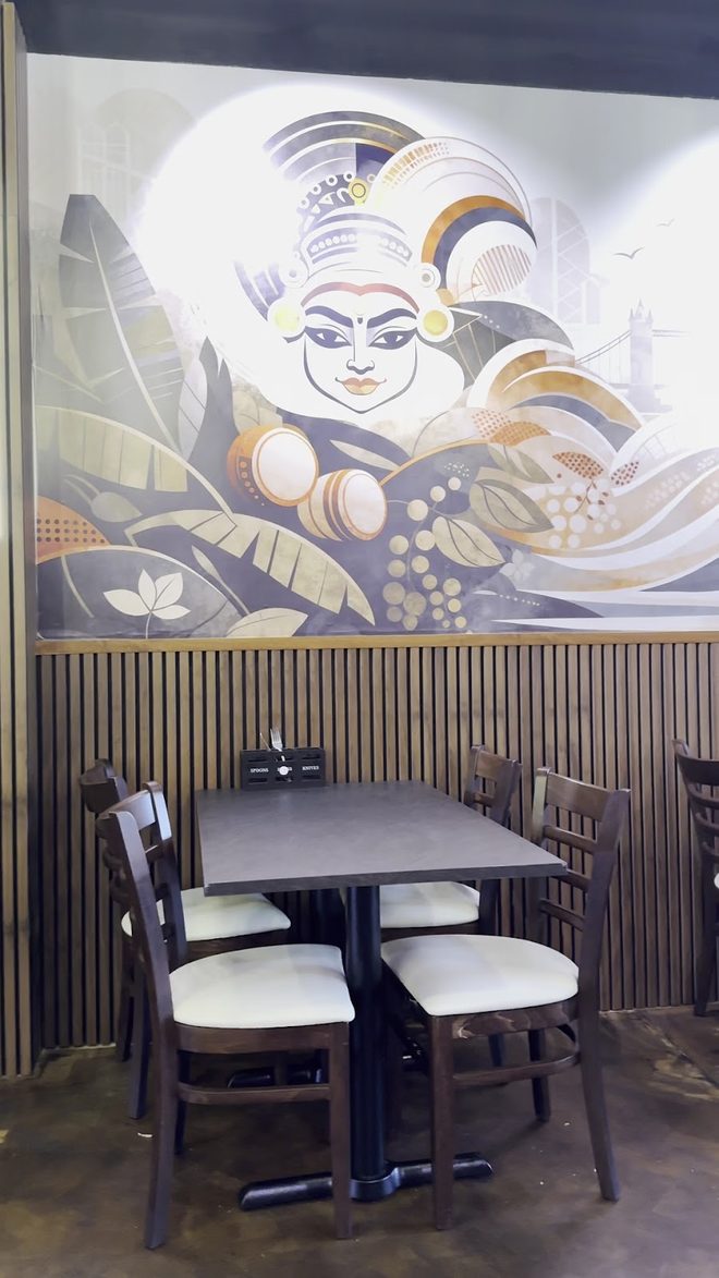 The dining room with its large Kathakali-style mural