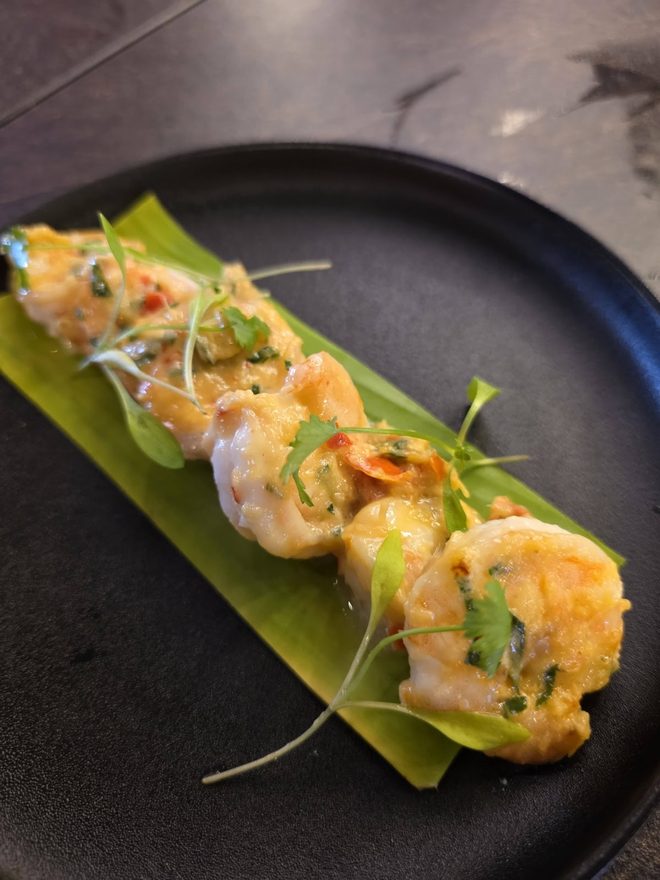 Battered prawns on a banana leaf